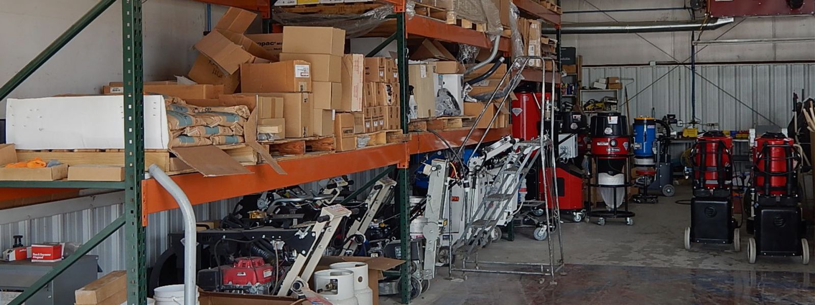 Dust control and other vacuum equipment inside a warehouse